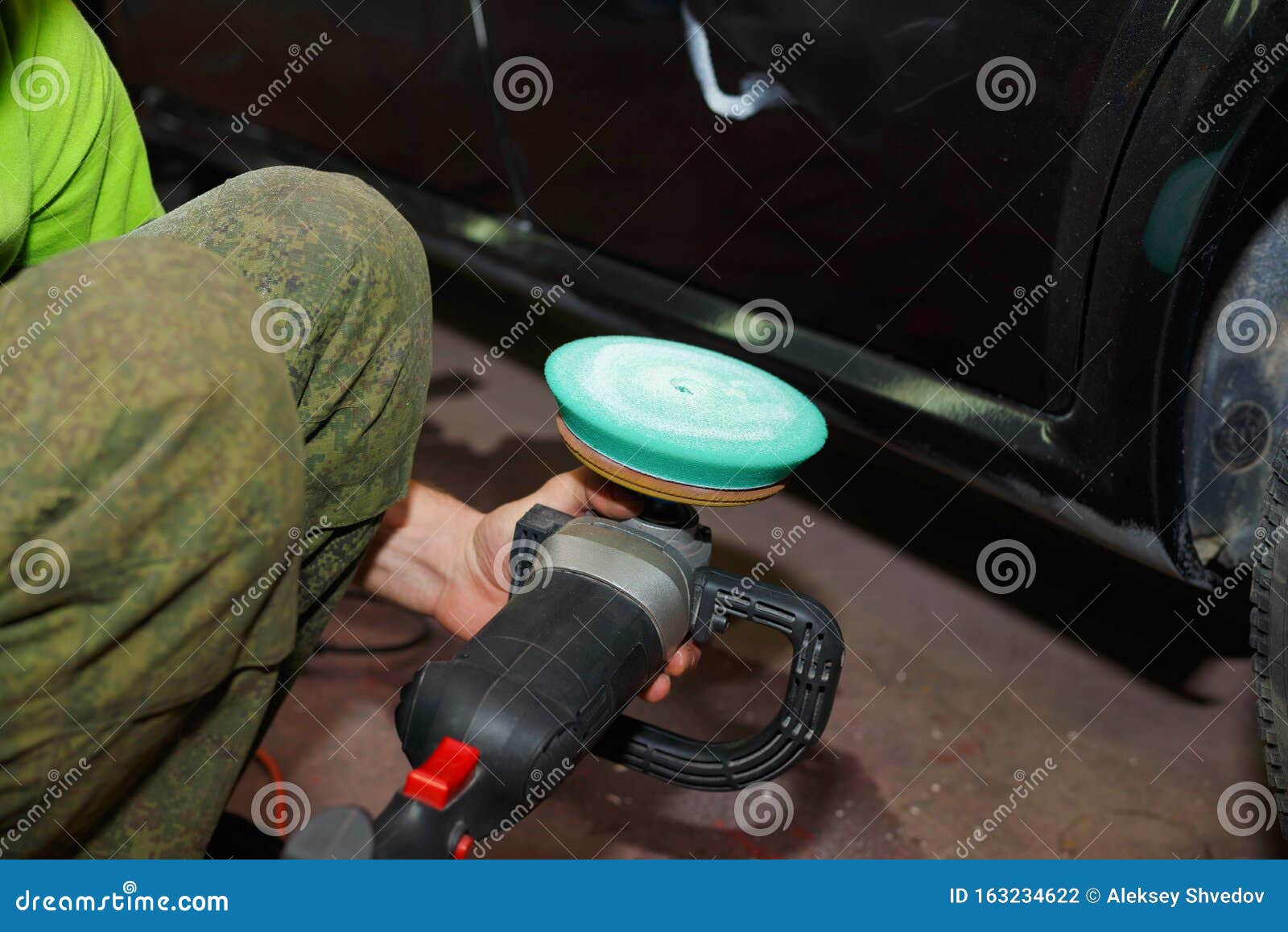 The Process of Applying Paste To a Grinding Machine Circle Stock Photo