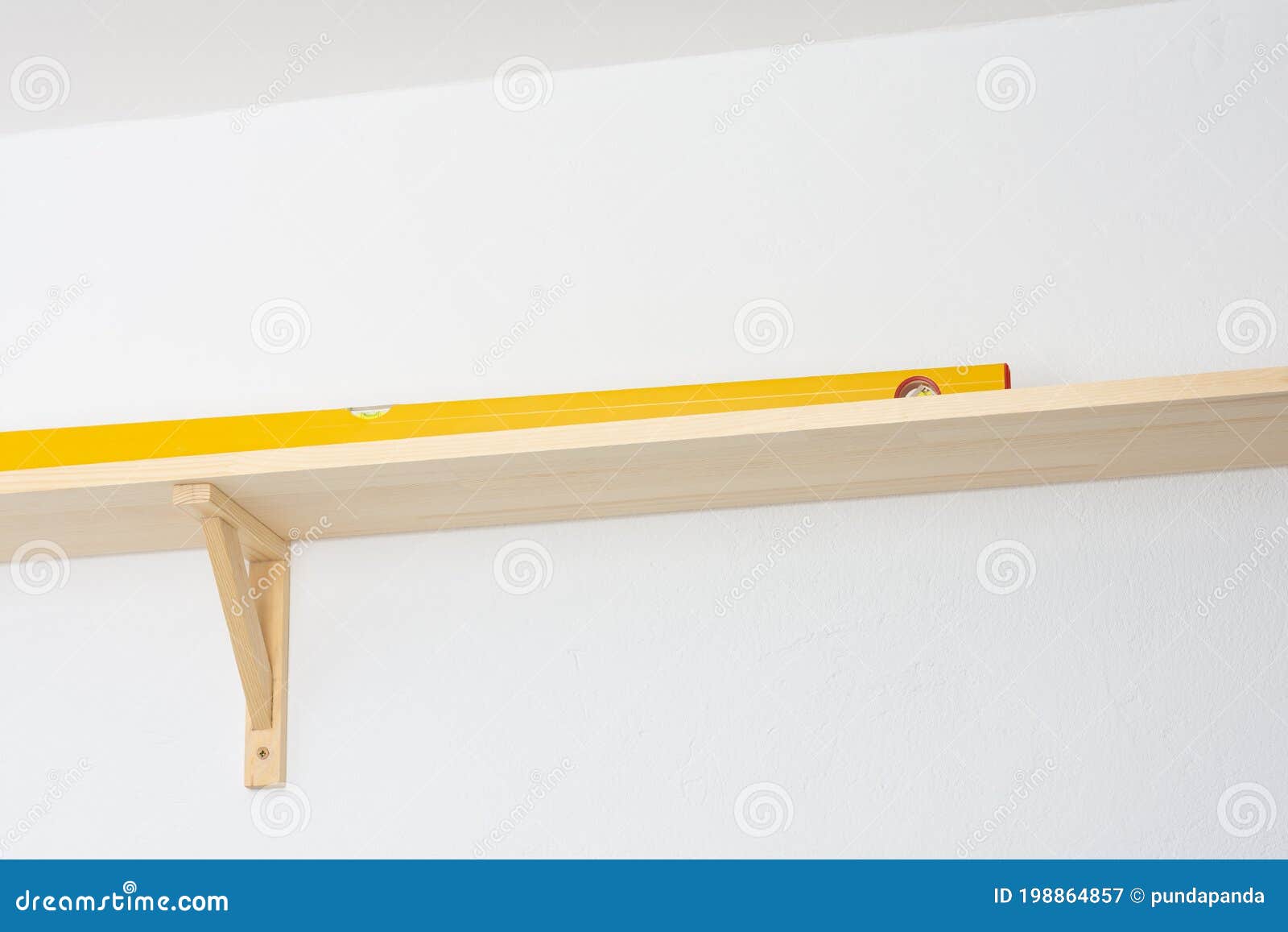The Process of Attaching a Wooden Shelf To the Wall Stock Image Image