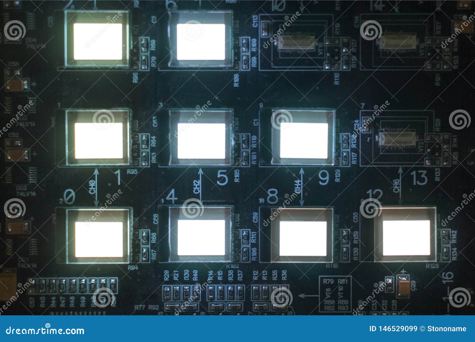 the process of checking several oled displays on the test station. displays glow brightly