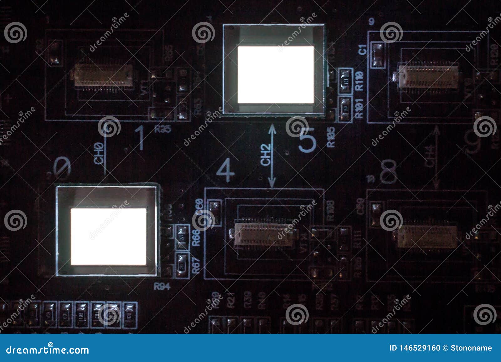 the process of checking several oled displays on the test station. displays glow brightly
