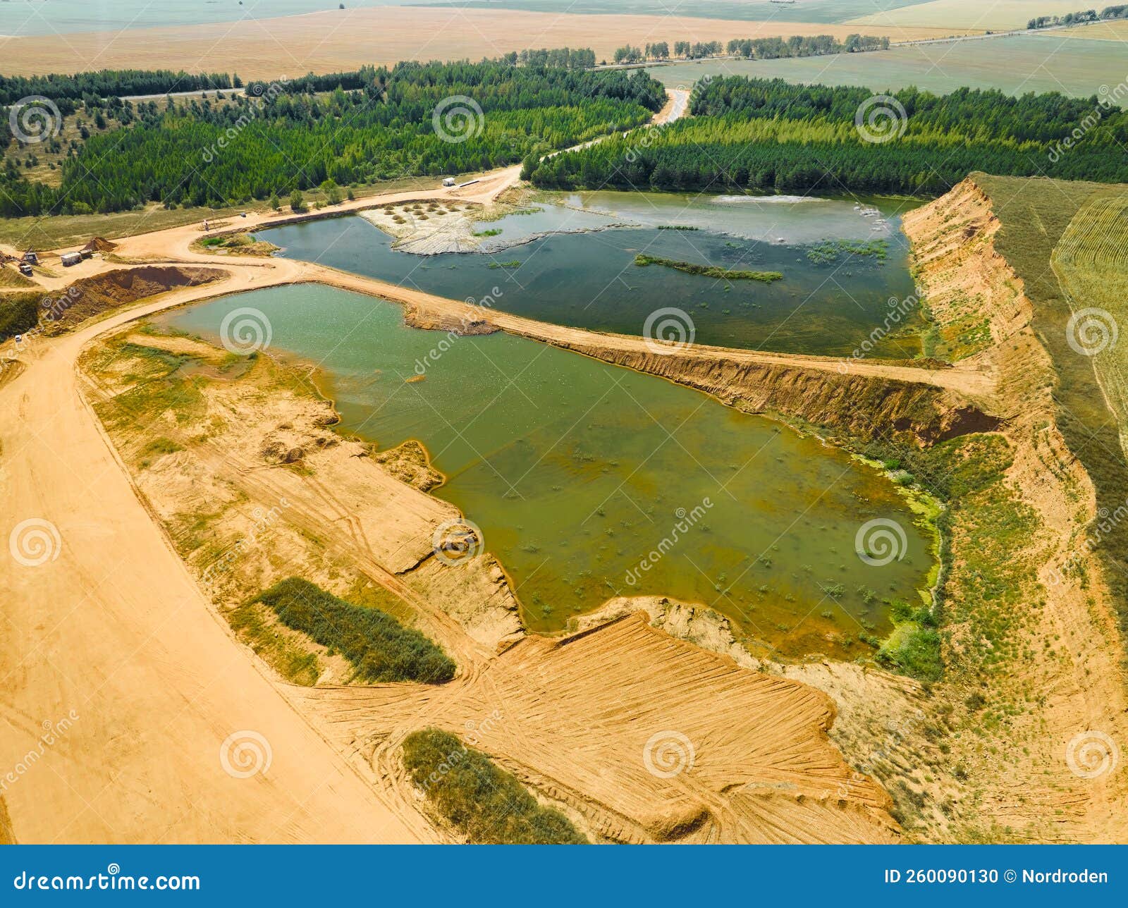 Process of Construction Sand Mining from Open Huge Quarry Stock Photo
