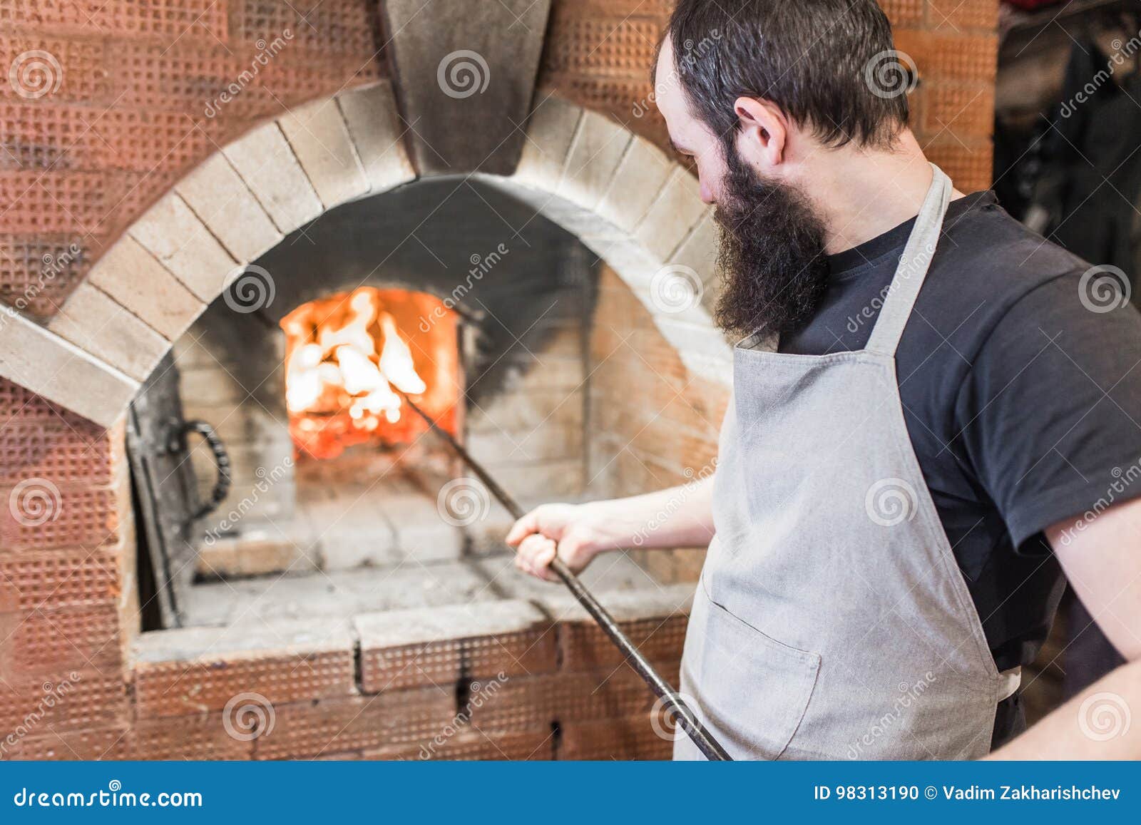 The Process of Cooking Baking Oven in the Countryside Stock Photo