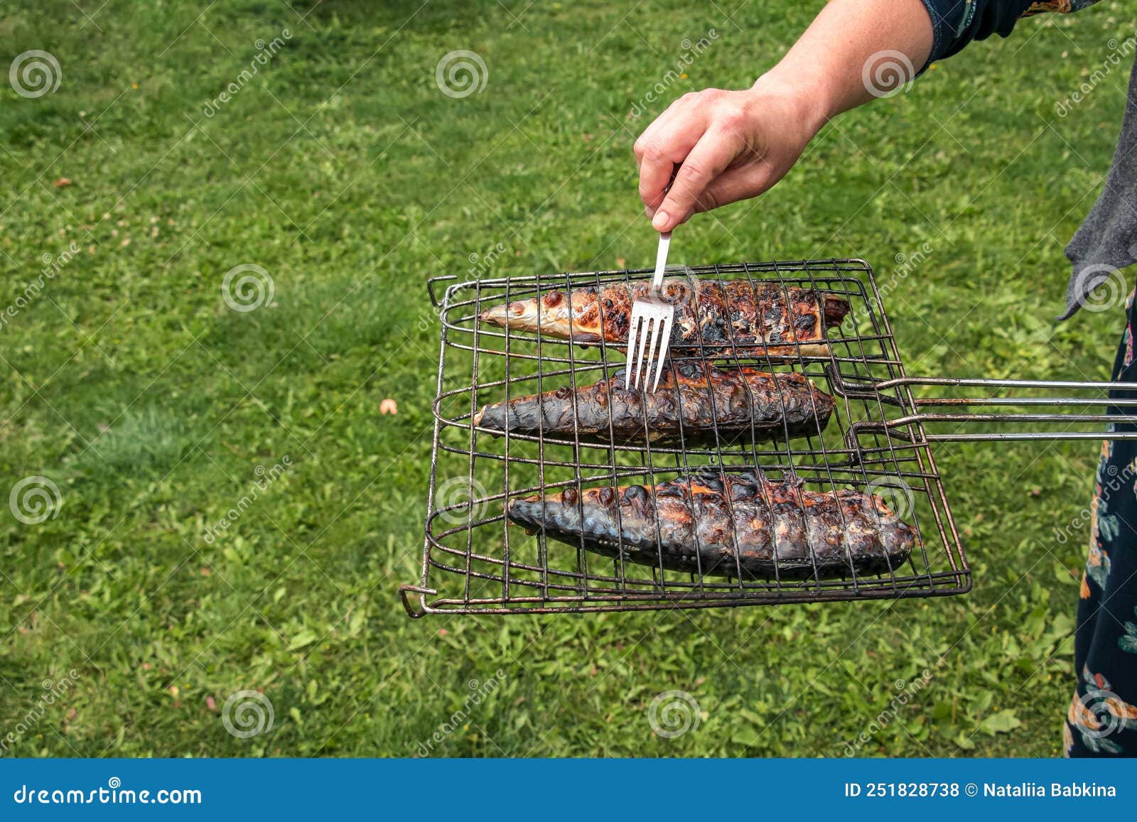 The Process of Cooking Mackerel Fish in a Marinade on the Grill. Fried
