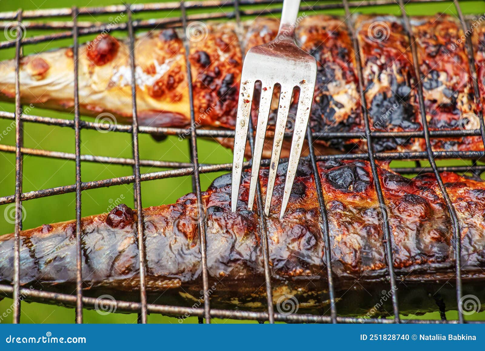 The Process of Cooking Mackerel Fish in a Marinade on the Grill. Fried