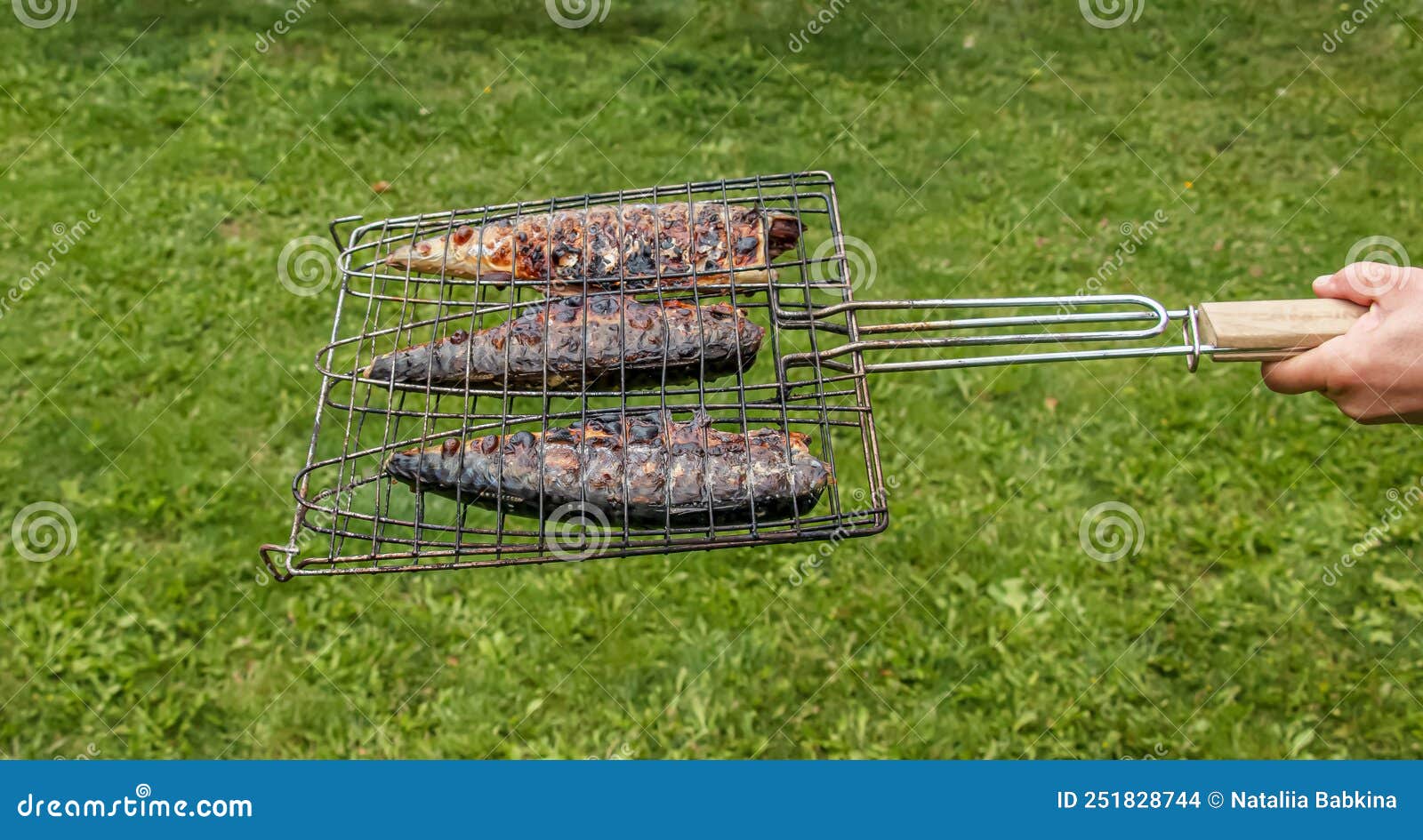 The Process of Cooking Mackerel Fish in a Marinade on the Grill. Fried