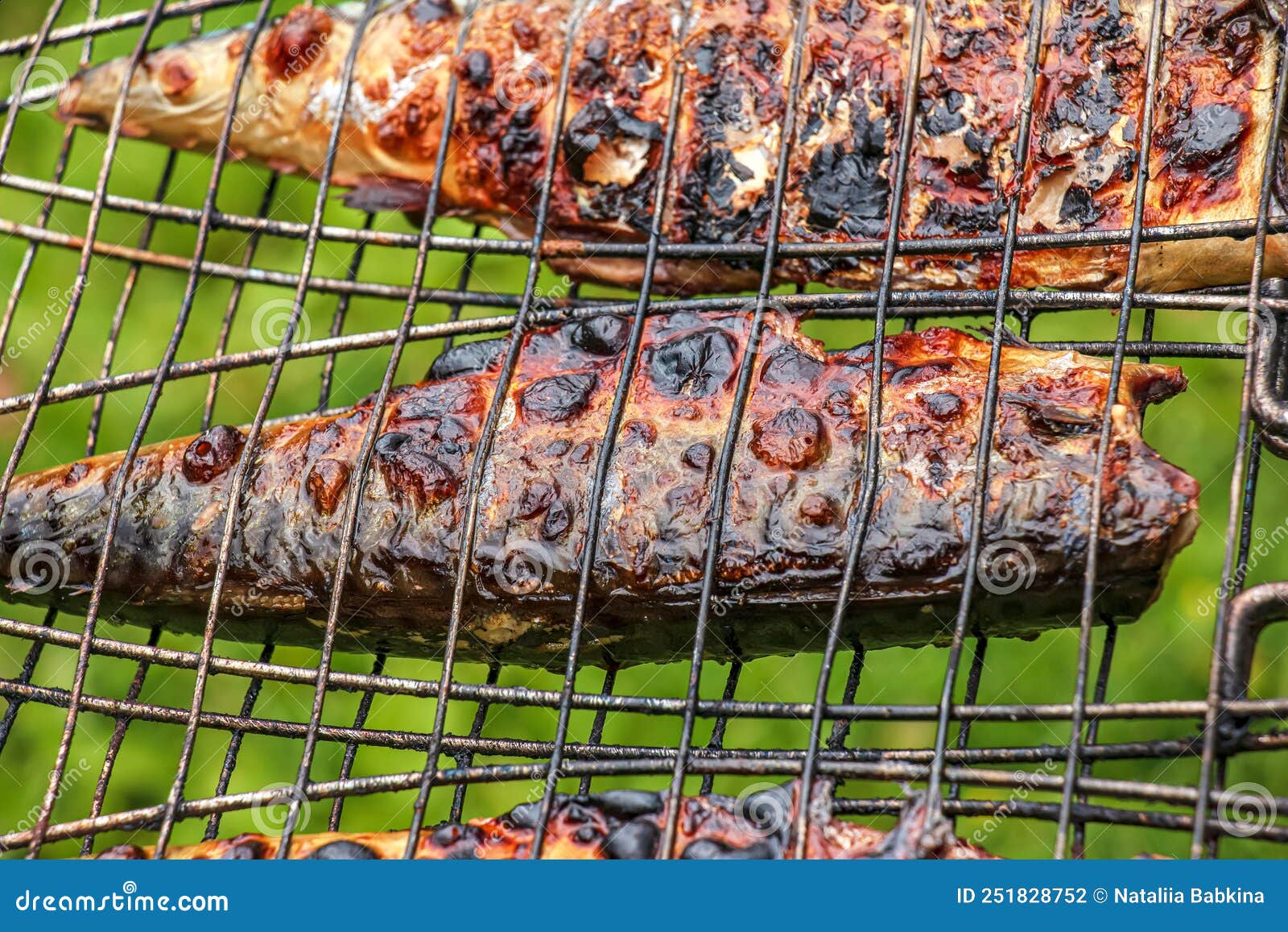 The Process of Cooking Mackerel Fish in a Marinade on the Grill. Fried