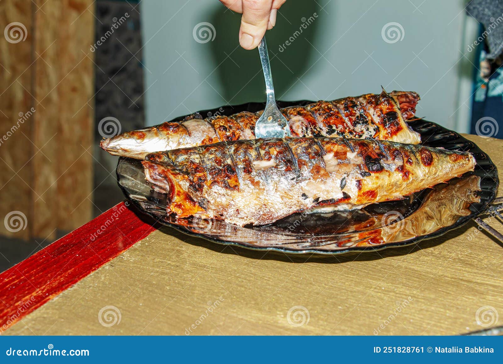 The Process of Cooking Mackerel Fish in a Marinade on the Grill. Fried