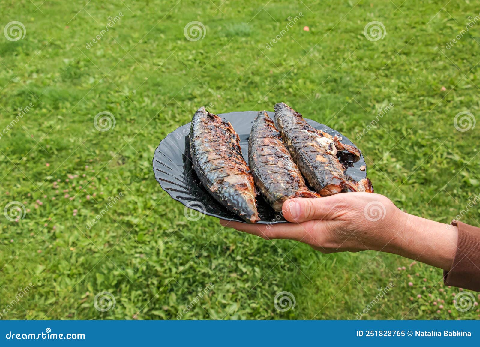The Process of Cooking Mackerel Fish in a Marinade on the Grill. Fried