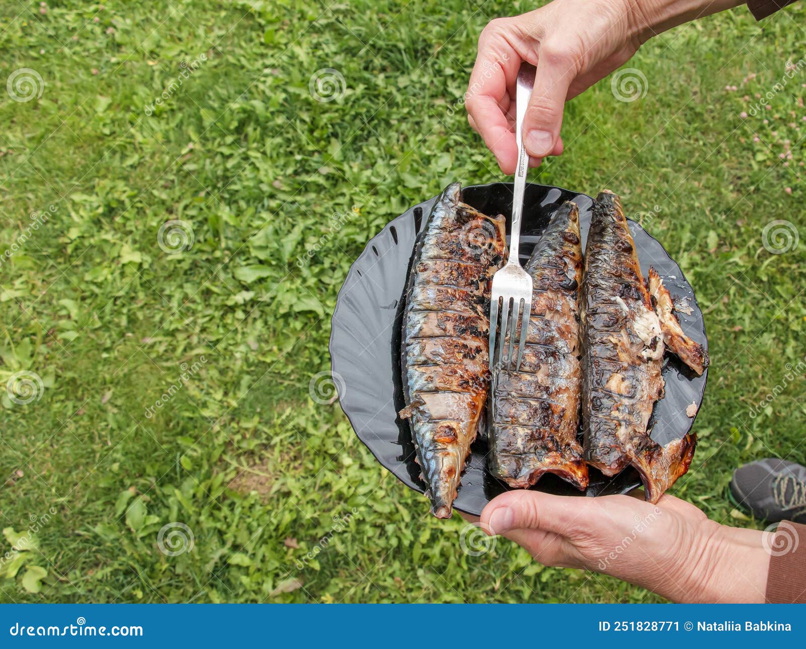 The Process of Cooking Mackerel Fish in a Marinade on the Grill. Fried