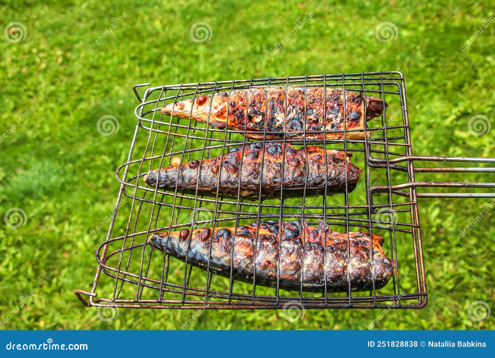 The Process of Cooking Mackerel Fish in a Marinade on the Grill. Fried