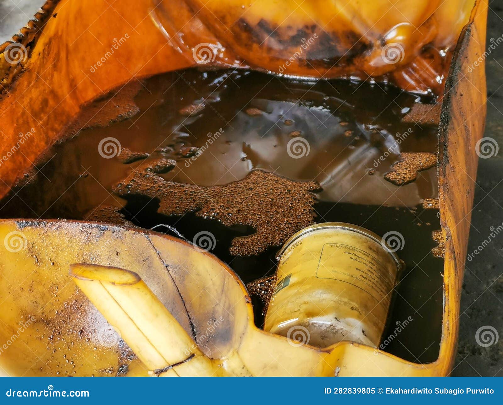 Process of Draining Old Dark Used Engine Oil. Stock Image Image of