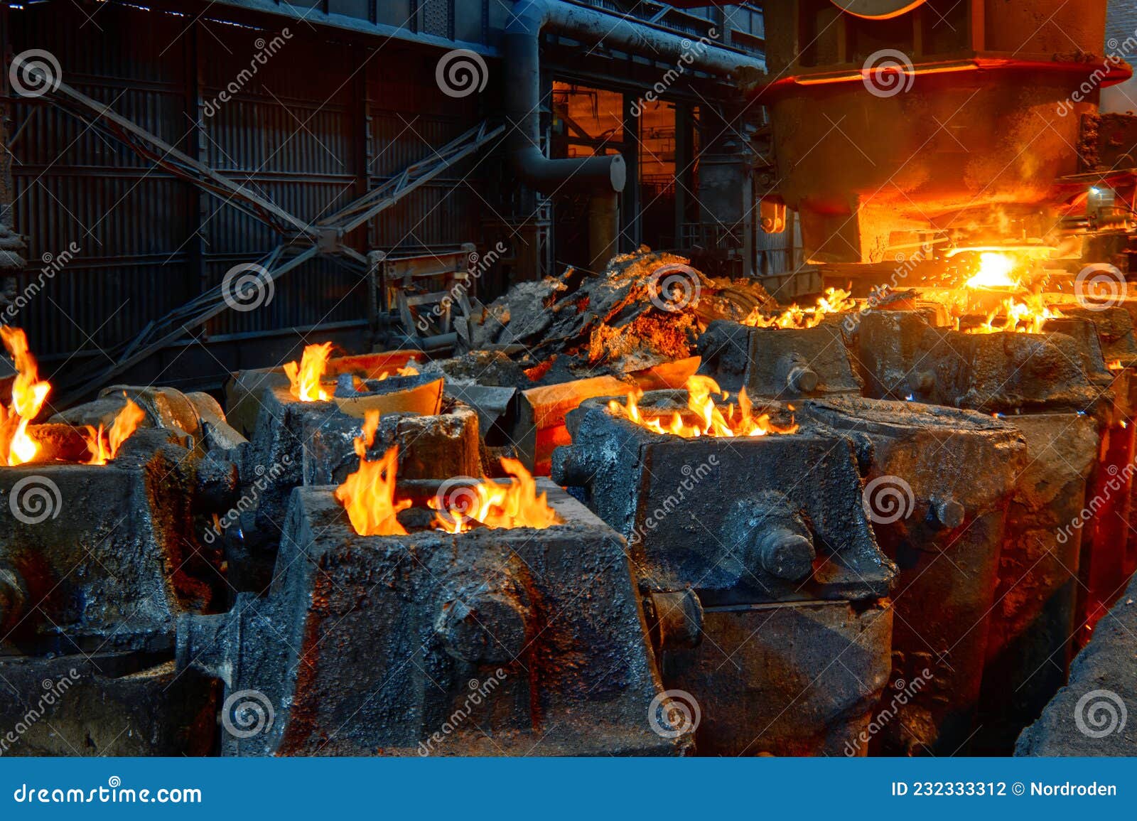 The Process of Filling Liquid Metal into Steel Molds Stock Photo