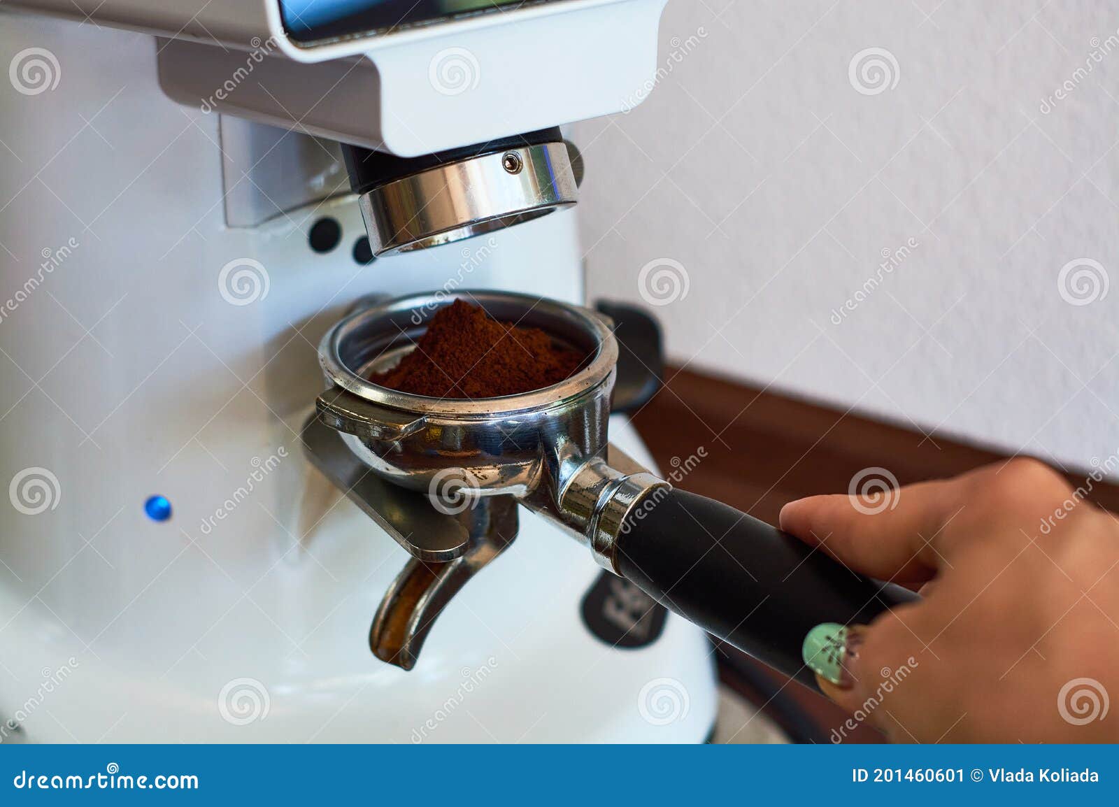 The Process of Grinding Grain into Holder for Making Espresso on Coffee