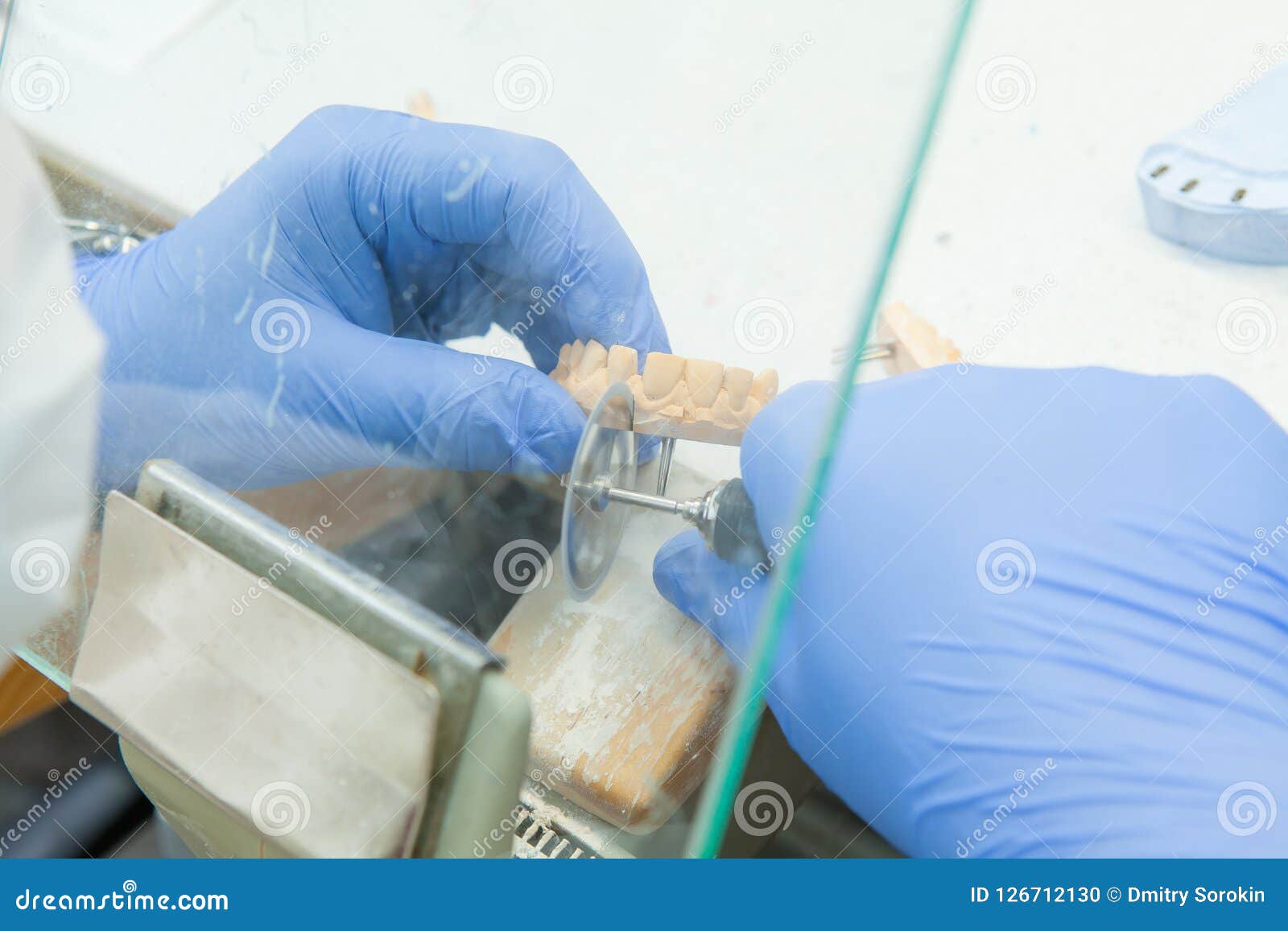 Process of Grinding the Jaw during Production. the Dental Technician