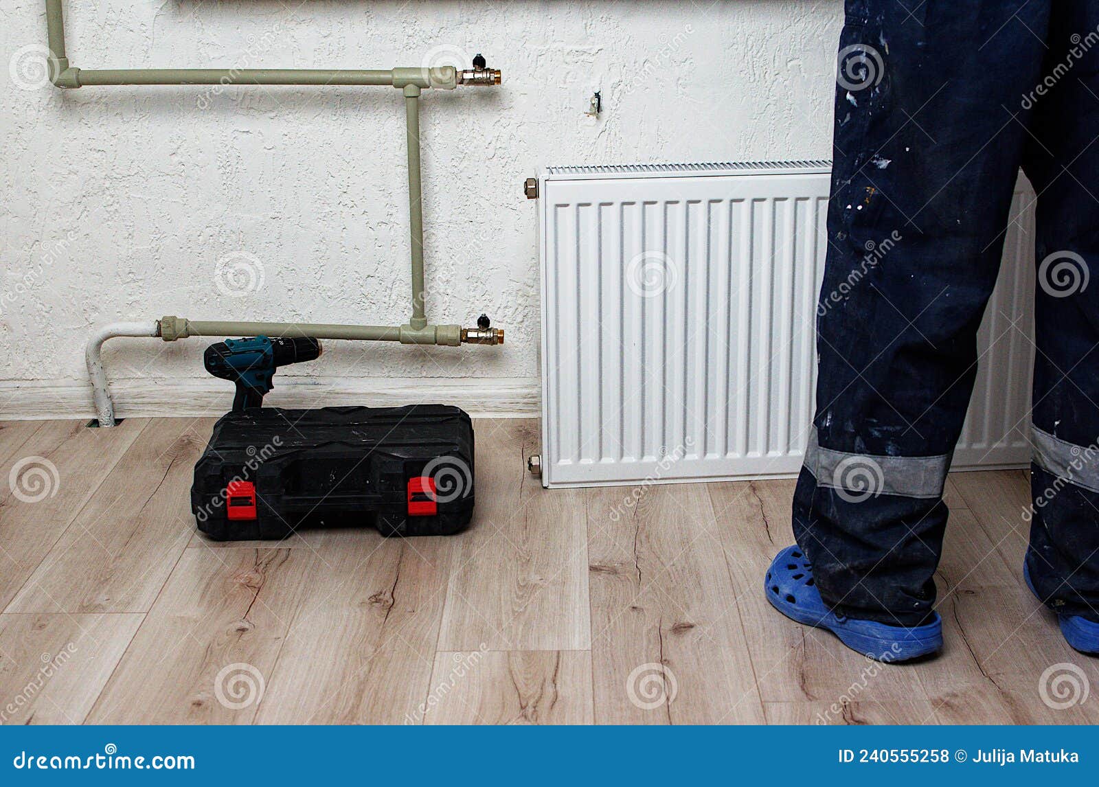 The Process of Installing a Battery To Water Pipes. Heating System