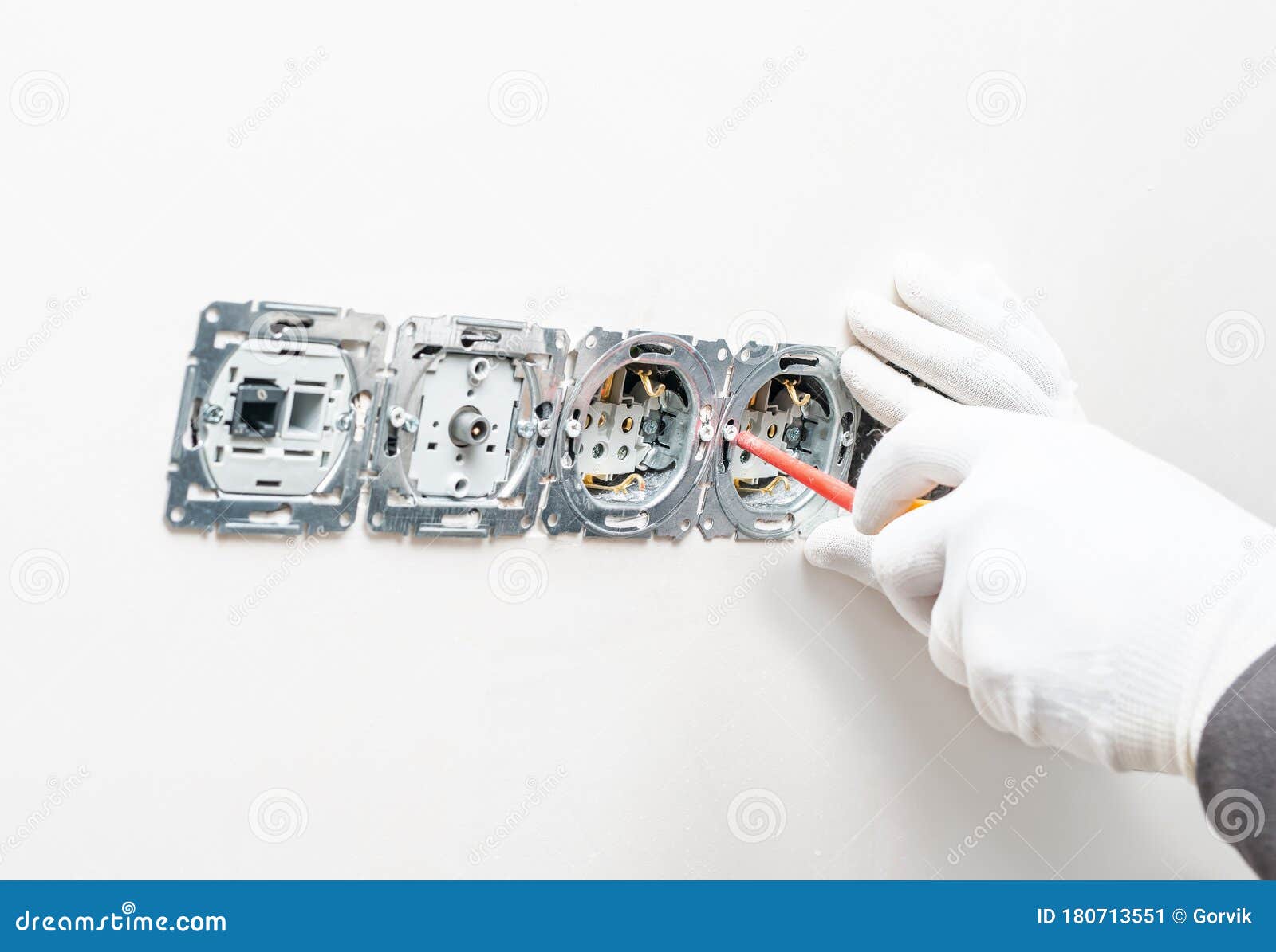 the process of installing internal sockets on a background of white gypsum wall