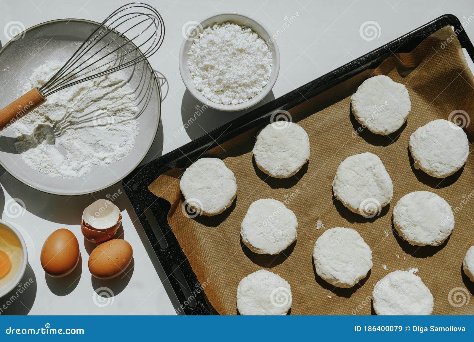 The Process of Making Curd Cheesecakes. Cheesecakes on a Baking Sheet