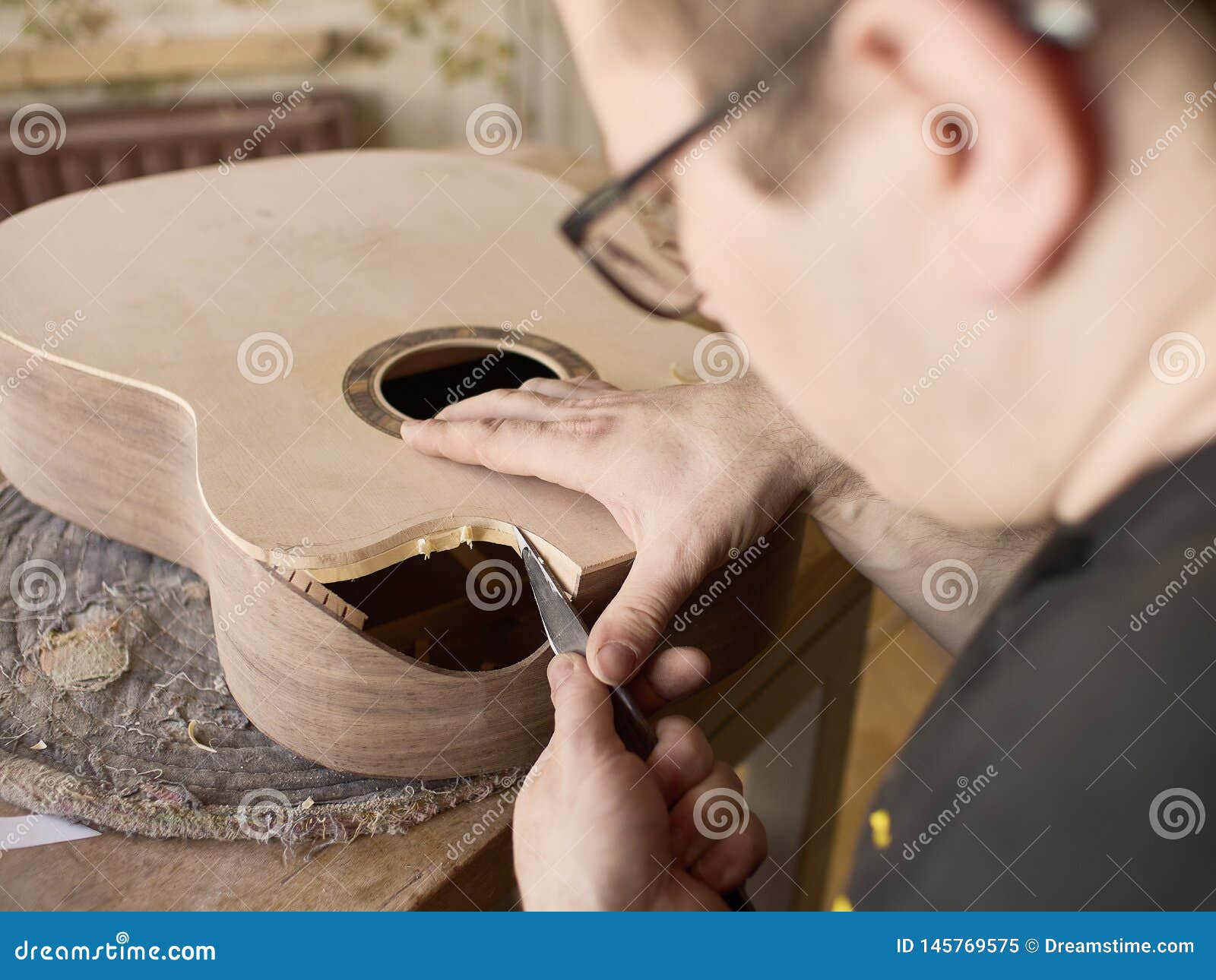 The Process of Making a Cutaway on Classical Guitar. Stock Image