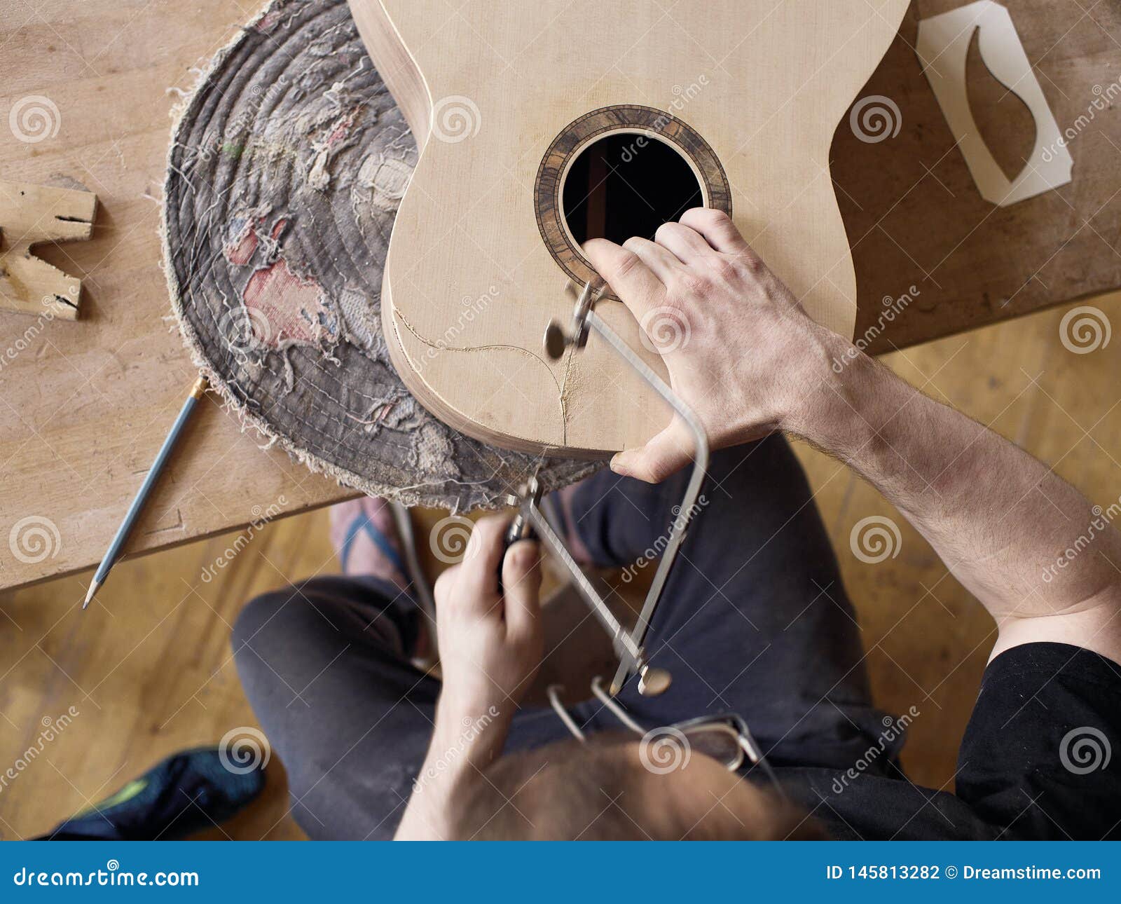 The Process of Making a Cutaway on Classical Guitar. Stock Photo