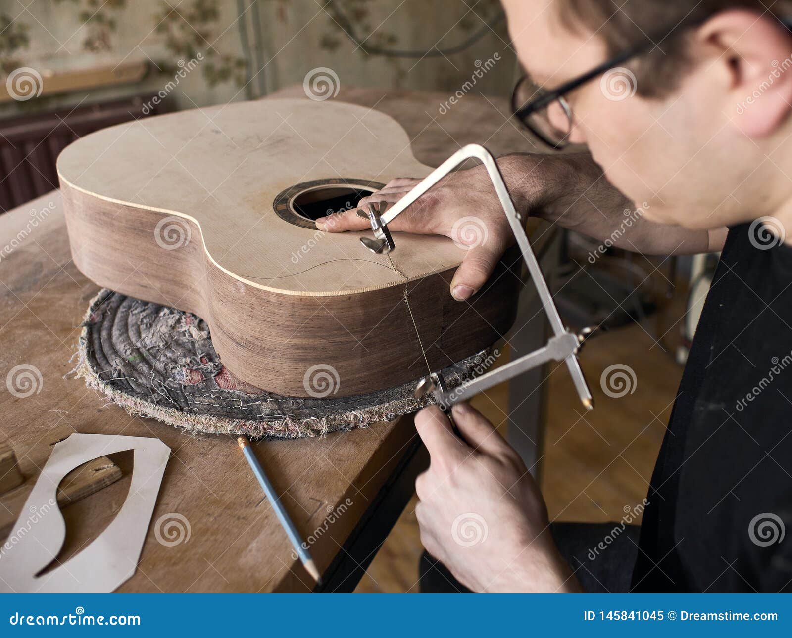The Process of Making a Cutaway on Classical Guitar. Stock Image