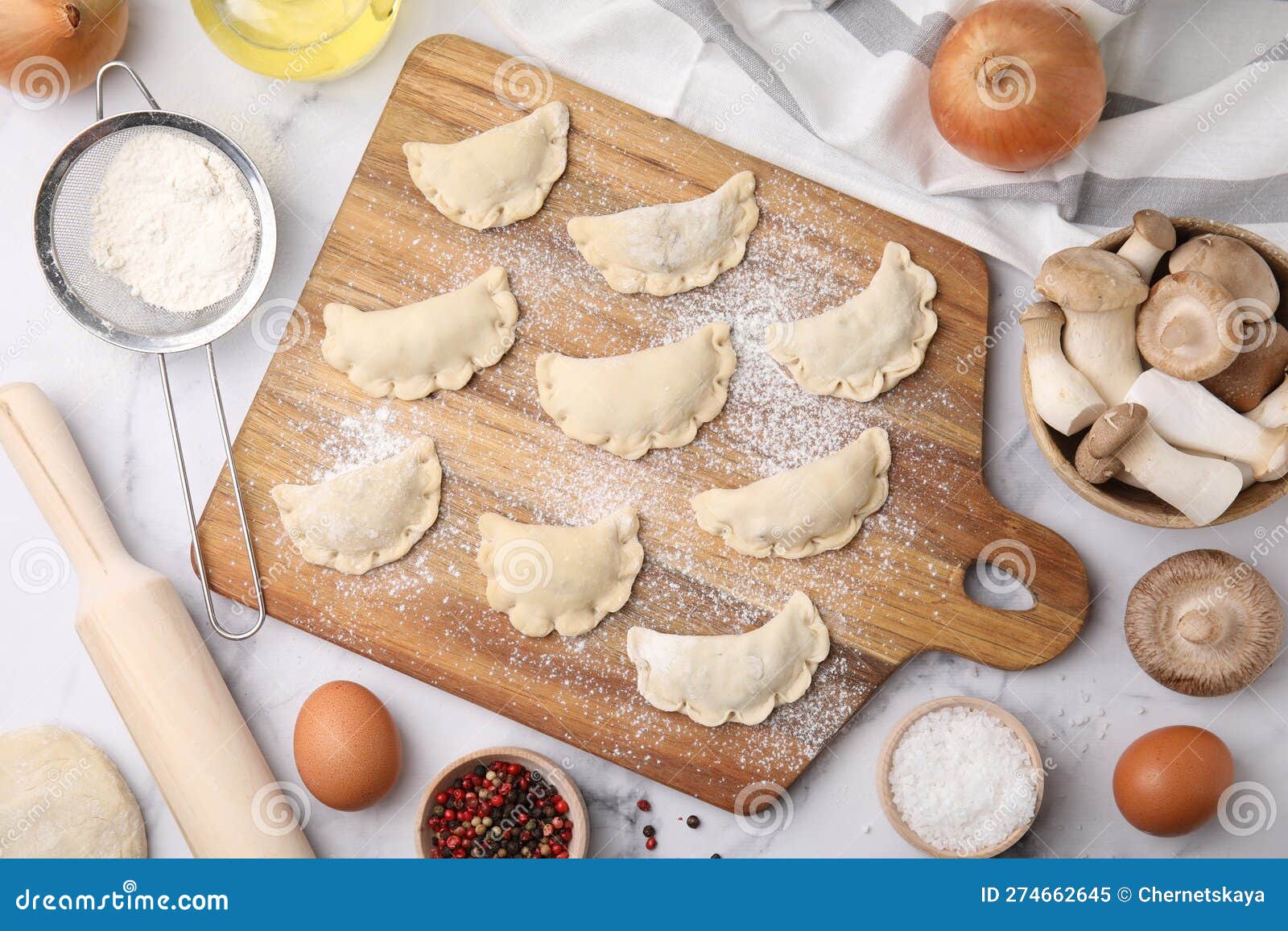 Process of Making Dumplings (varenyky) with Mushrooms. Raw Dough and Ingredients on White Marble