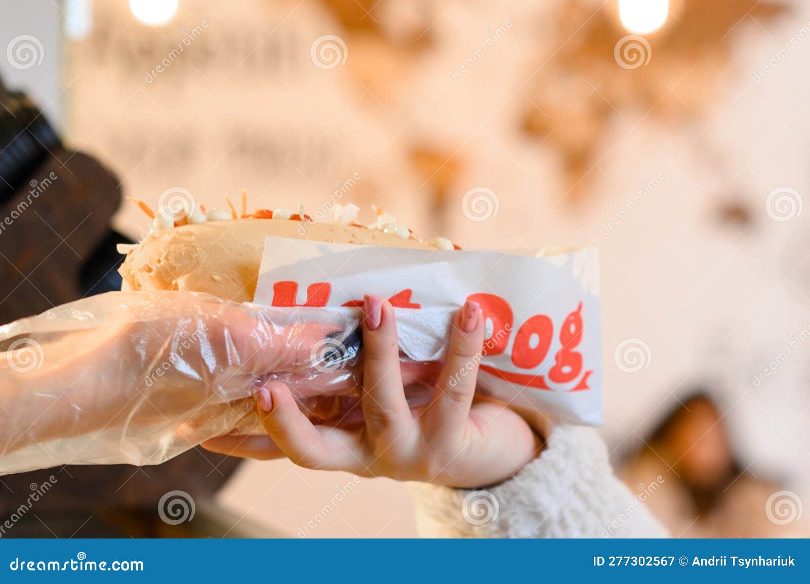 The Process of Making a Hot Dog, a Worker Fulfills a Customer S Order and Prepares a Hot Dog
