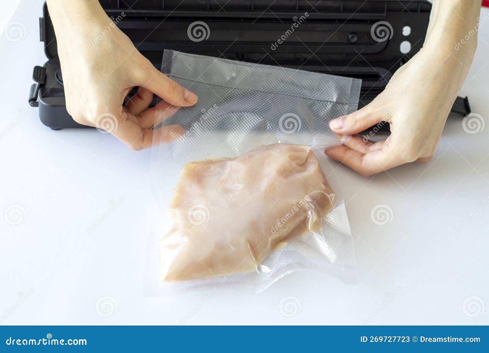 The Process of Packing Chicken Fillets in a Vacuum Bag Using a Special
