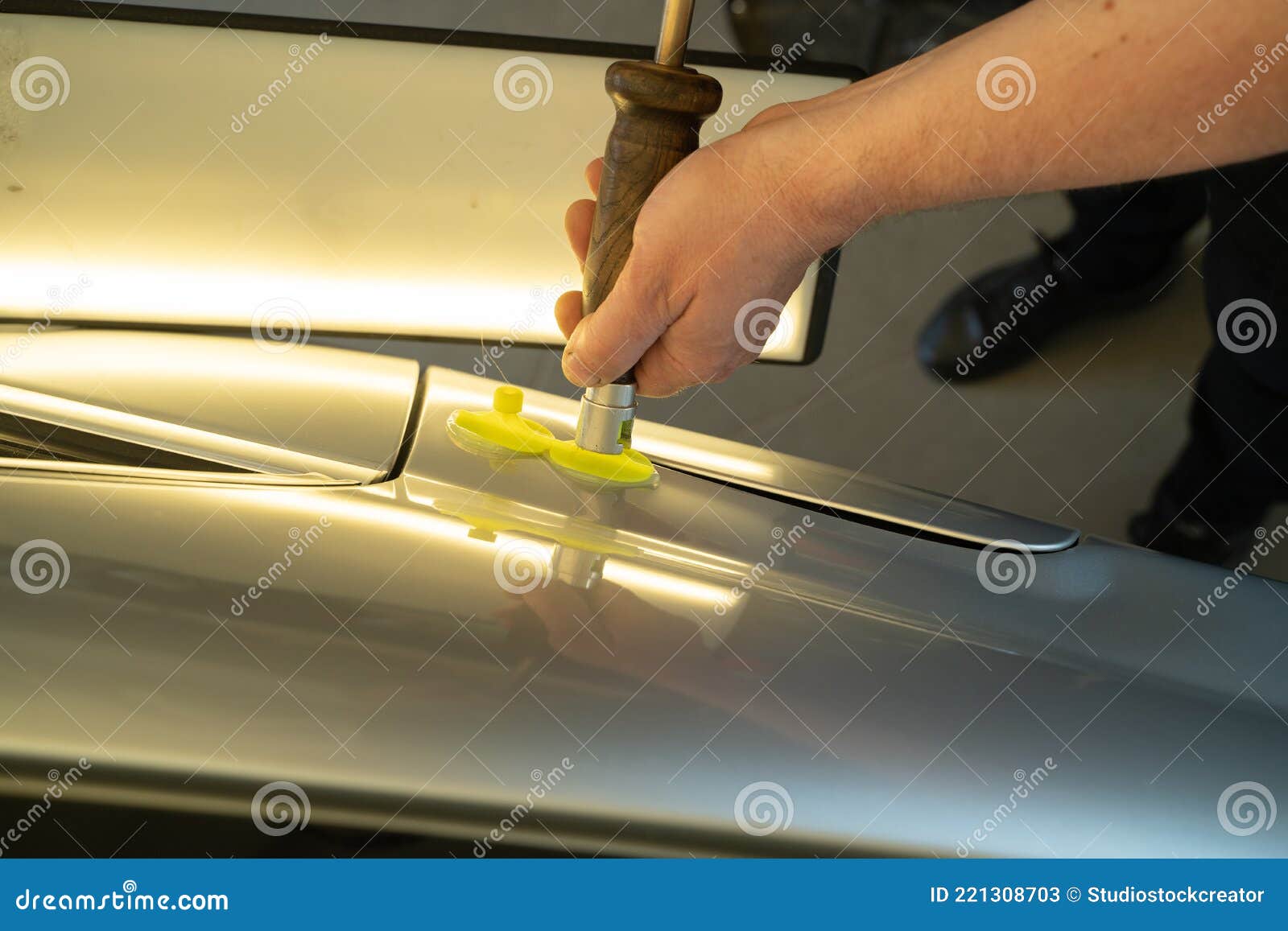 Process of Paintless Dent Repair on Car Body. Technician S Hands