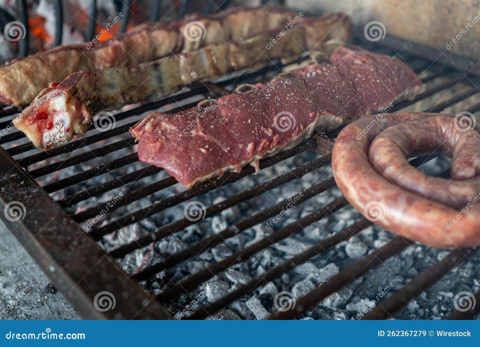 Process of Preparing a Typical Argentinian Asado with Beef and Sausage