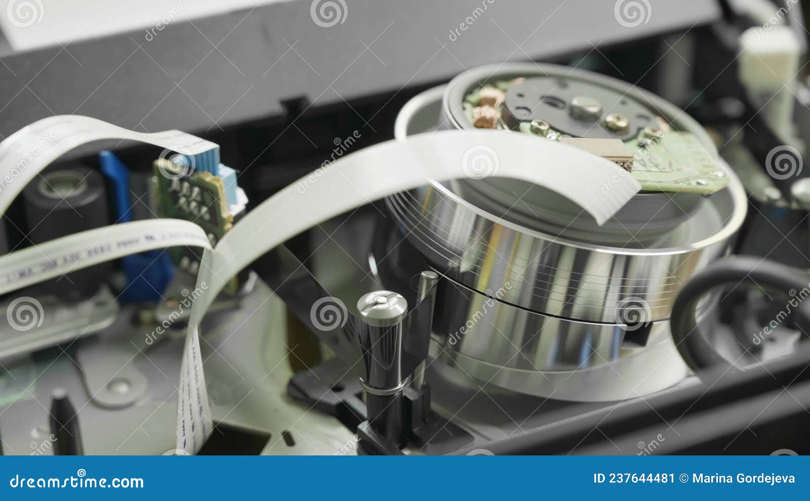 The Process of Pulling the VHS Cassette Film from the Cassette Body To the Drum of the VCR Head