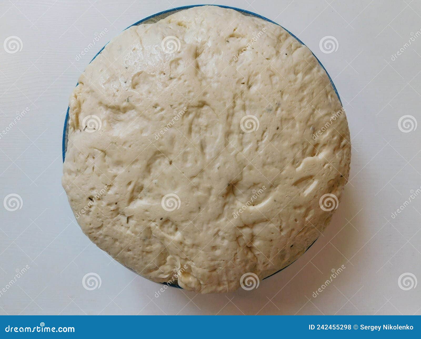 The Process of Raising the Dough in a Special Basket. Dough Made from