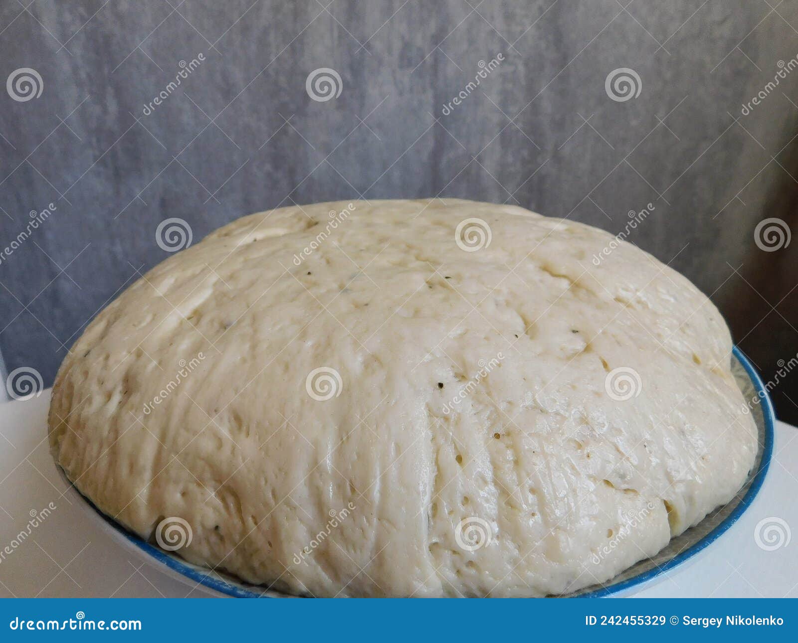 The Process of Raising the Dough in a Special Basket. Dough Made from