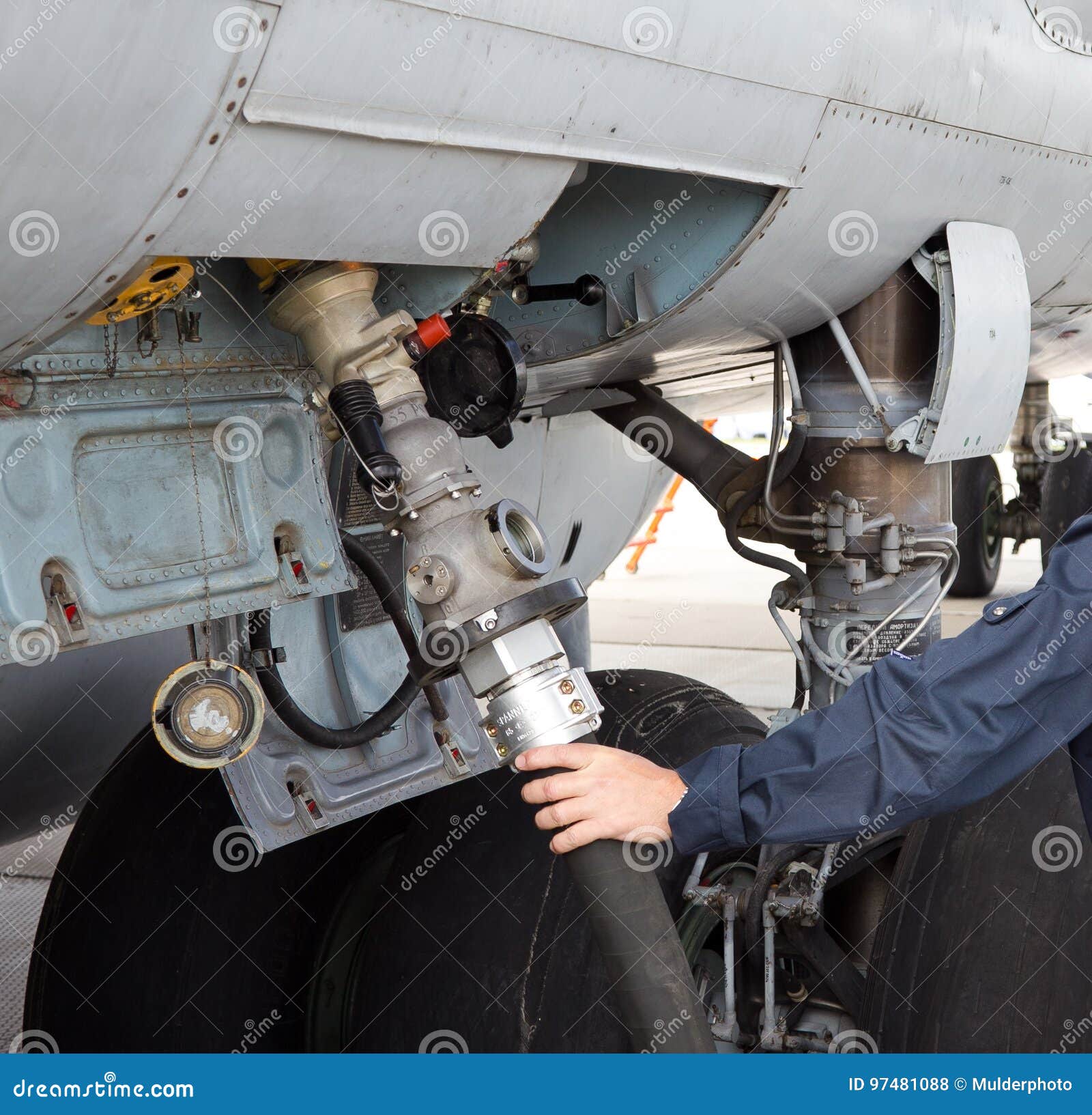 The Process Of Refueling Airplane In Airport. Fuel Hose Is Inserted Stock Photo Image of
