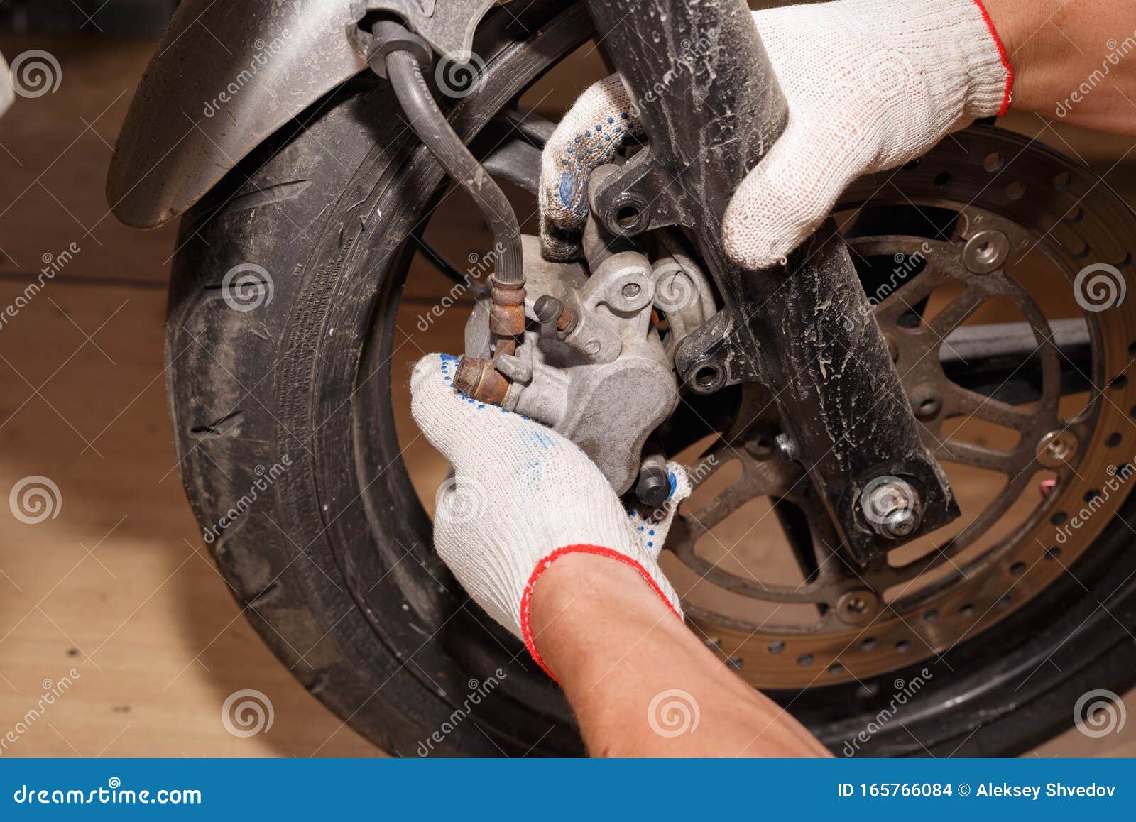 The Process of Replacing Brake Pads on a Motorcycle Stock Photo Image