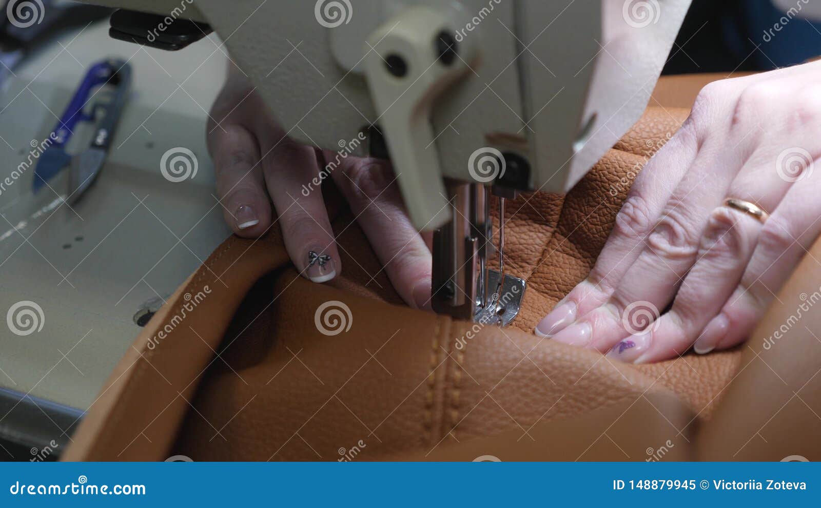 Process Of Sewing Artificial Leather. Needle Of Sewing Machine In A Sewing Machine Needle Moves Up And Down