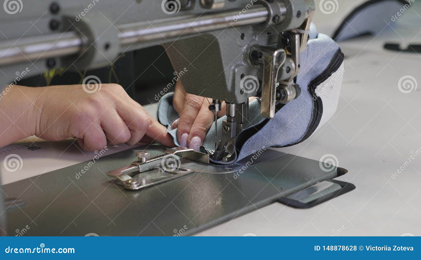 Process of Sewing Leather Goods. the Needle of the Sewing Machine in