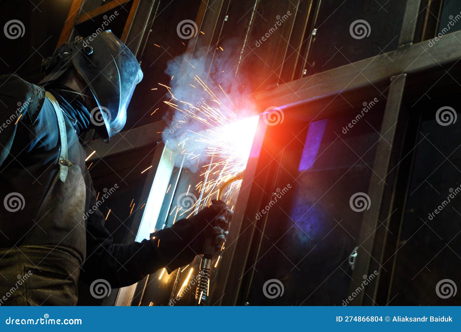 The Process of Welding a Vertical Joint in a Product Stock Photo