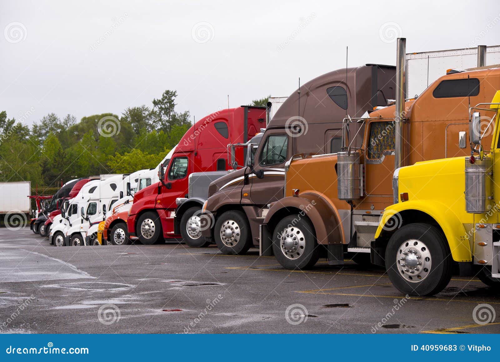 procession colorful trucks on the truck stop after the rain