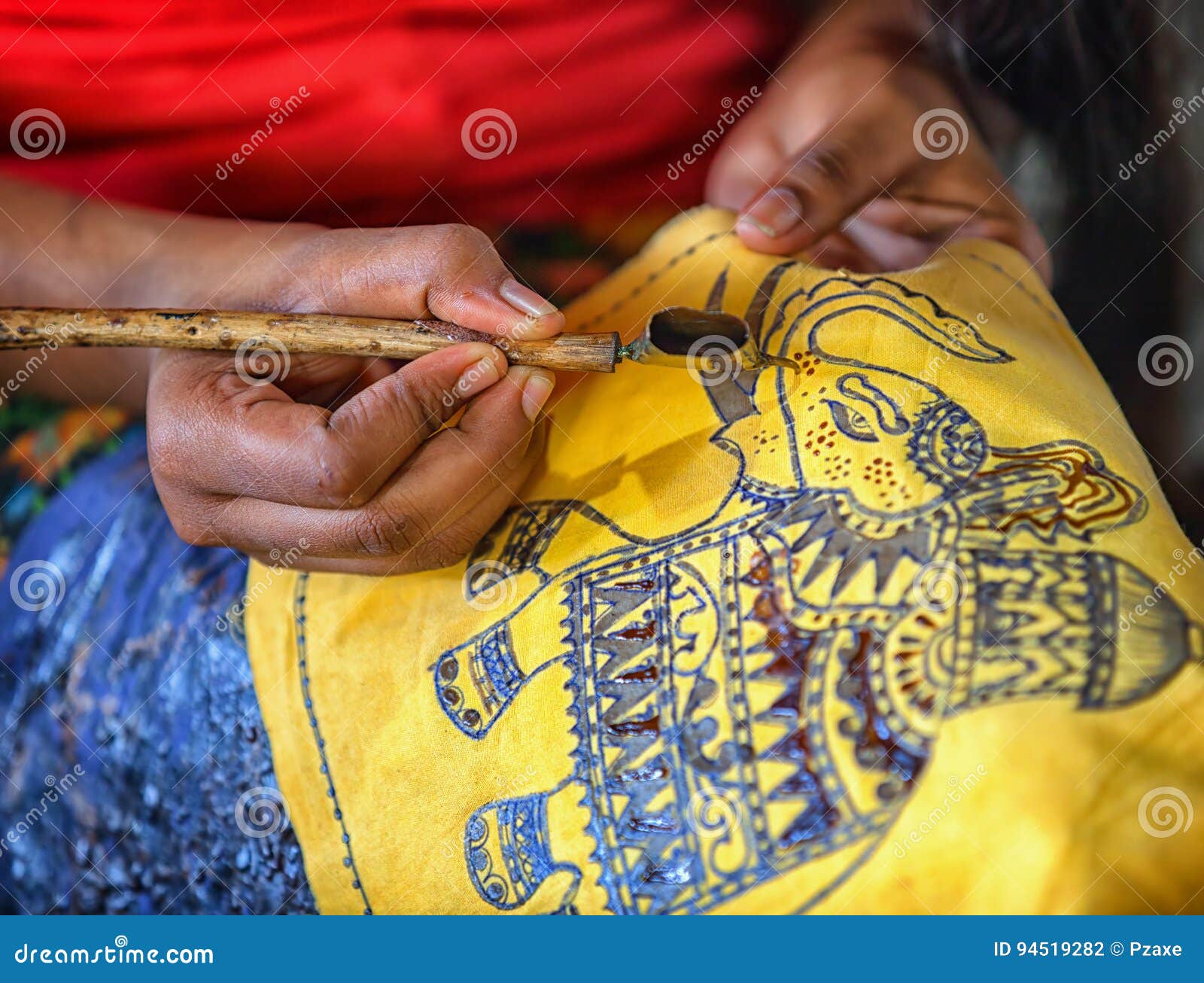 ANURANHAPURA, SRI LANKA - CIRCA APR 2013: production of batik - Spouted tool - canting. Tjanting.