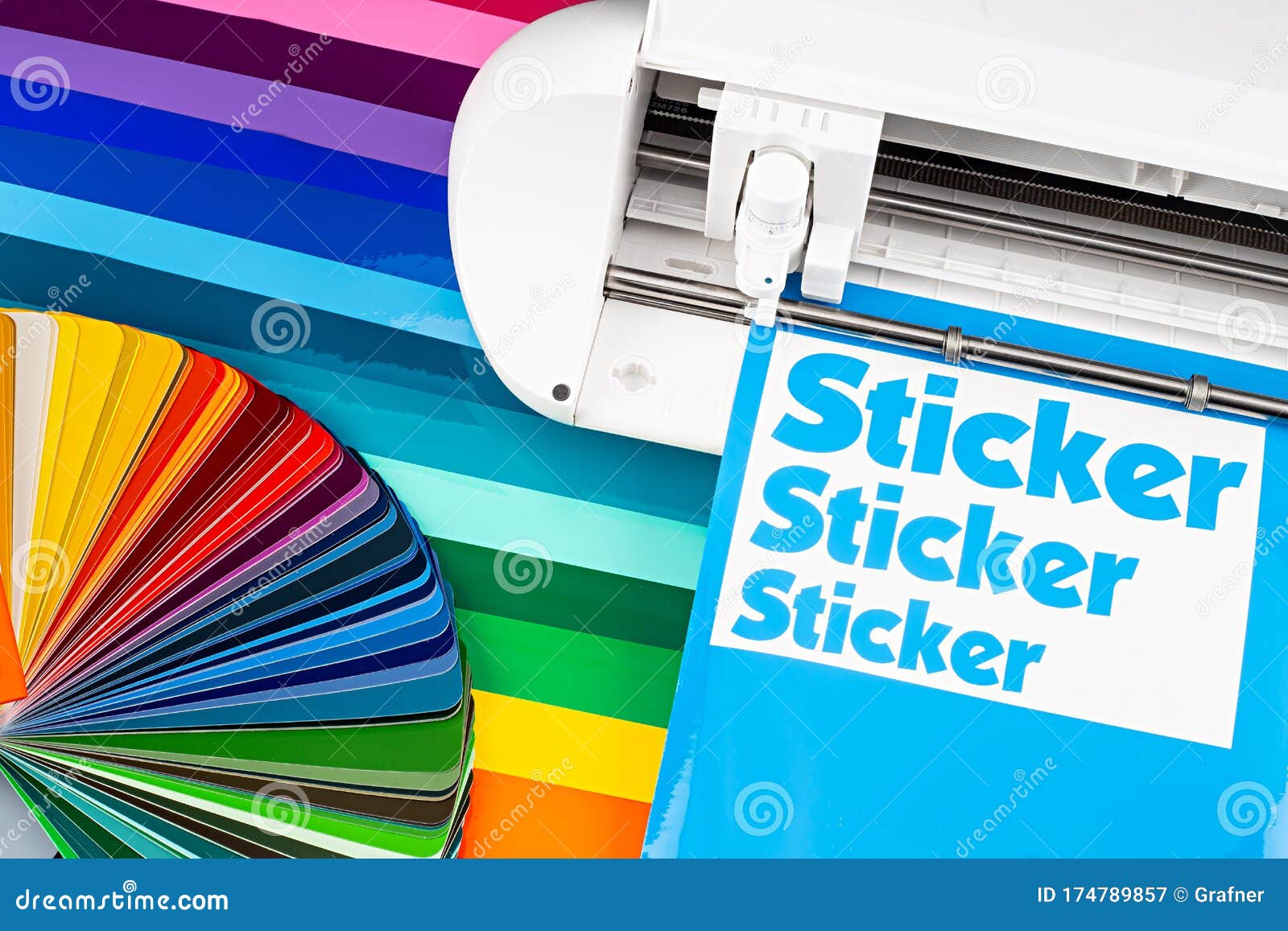 production making sticker with plotter cutting machine sheets of colorful various rainbow colored vinyl fim with color fan. guide