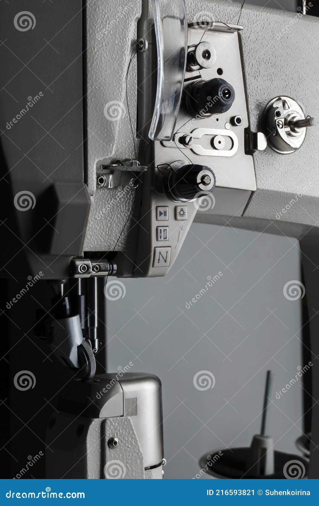 Production Sewing Machine on a Black Background Close-up. Details of a