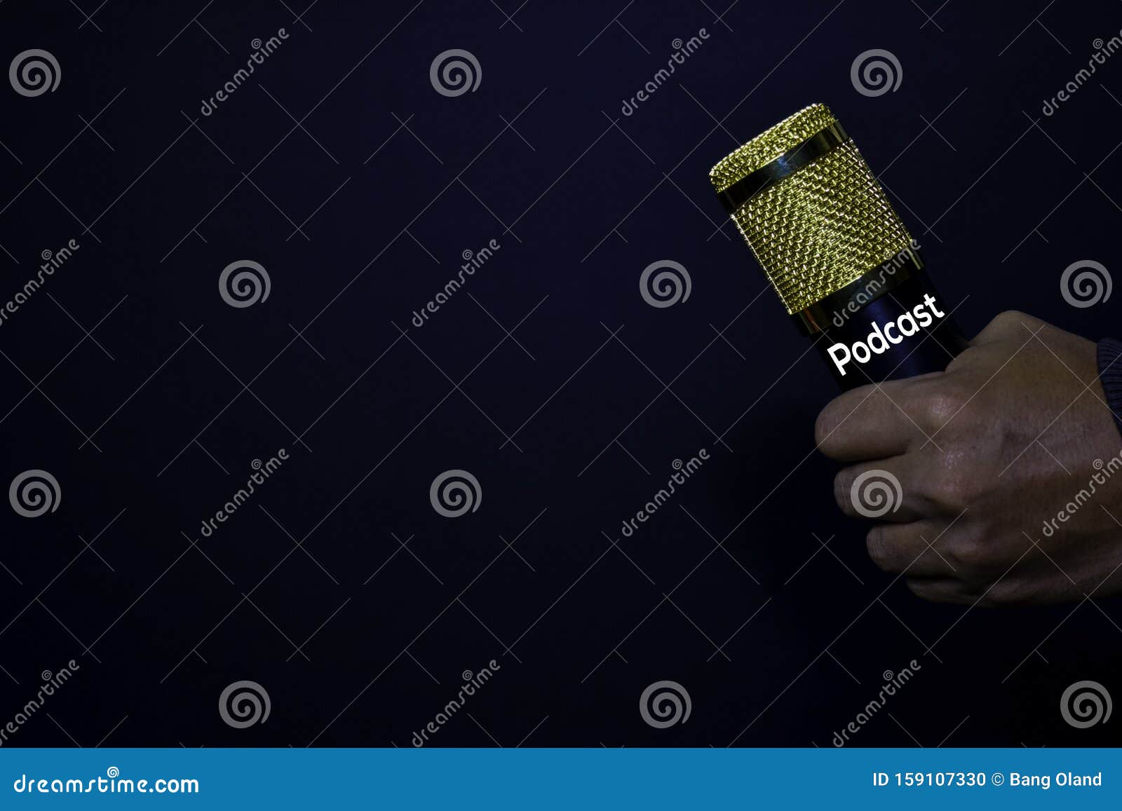 profesional microphone on hands  black background. podcast concept