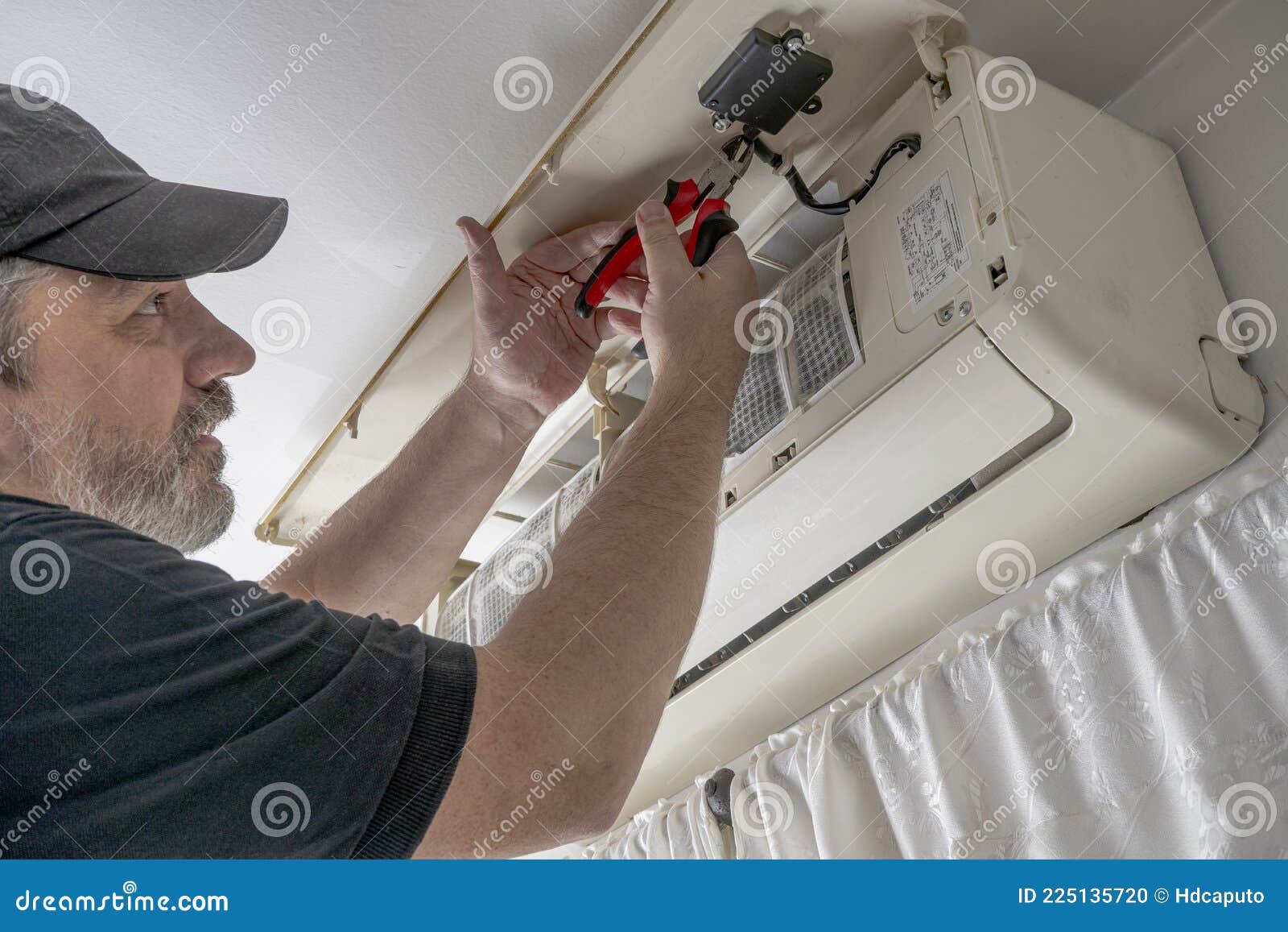 Professional Air Conditioning Technician Cutting the Internal Control