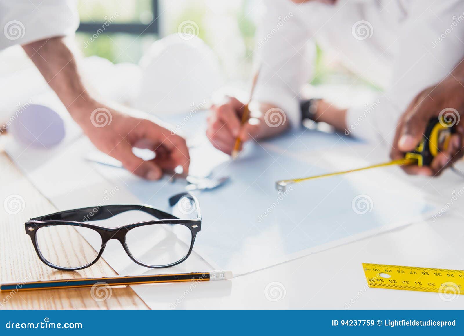 Professional Architects in Formal Wear Working at Modern Office Stock