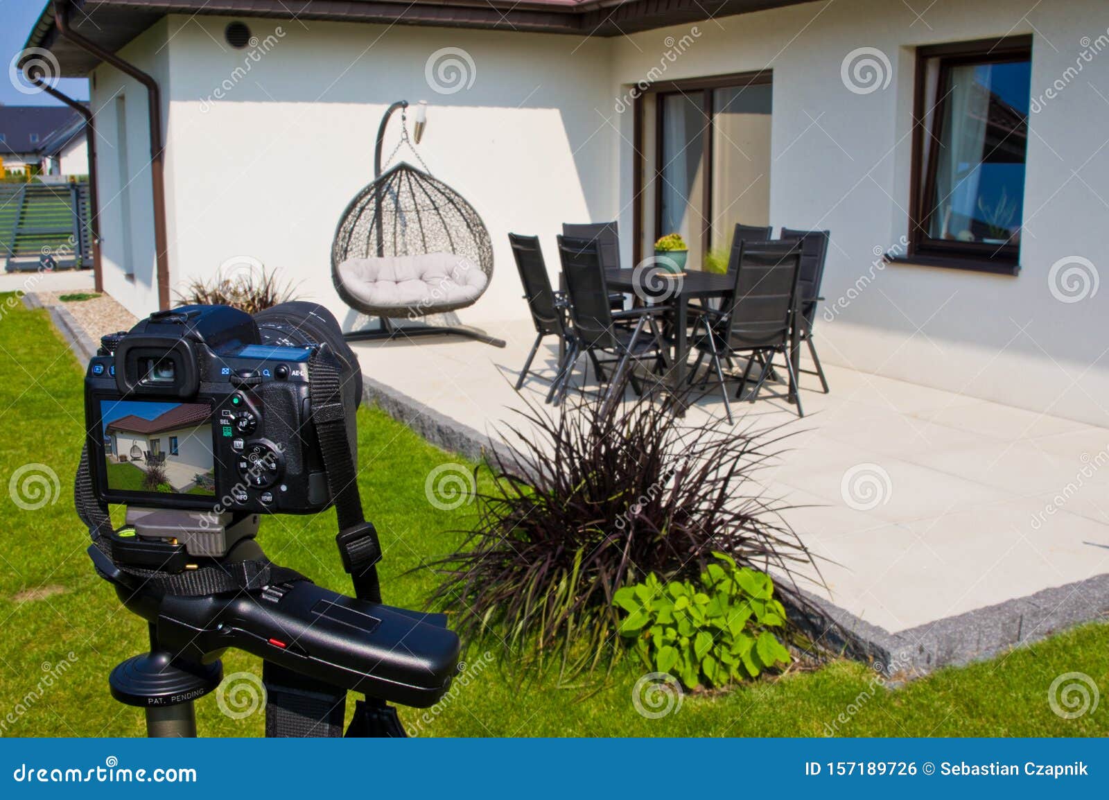 shooting house exterior, photographer camera, tripod and ballhead