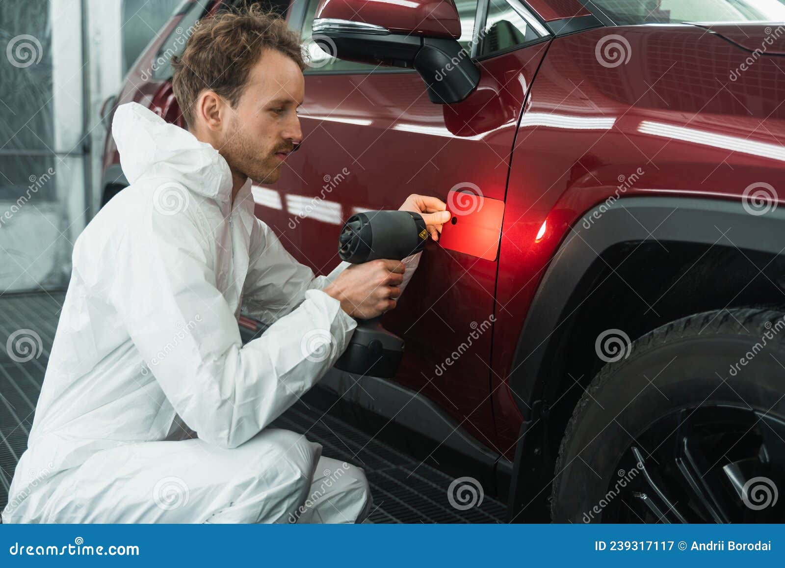 Professional Auto Painter Matches Car Paint Color with Lamp and Samples