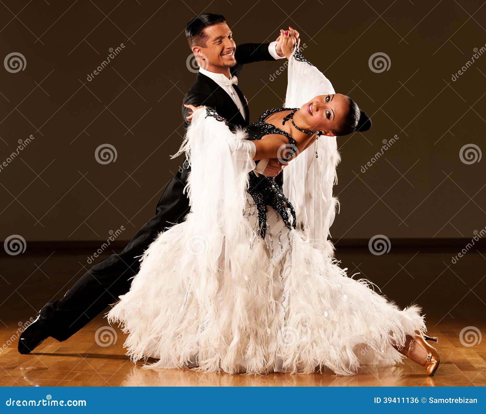professional ballroom dance couple preform an exhibition dance