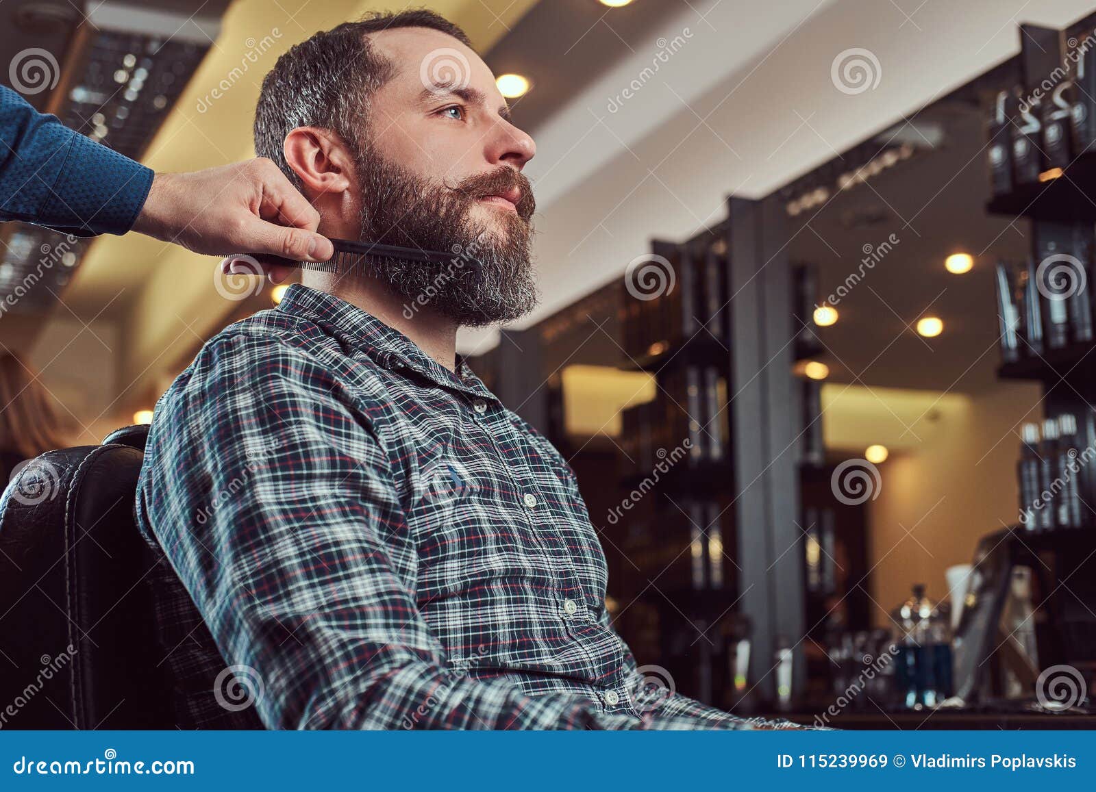Professional Barber Working with a Client in a Hairdressing Salon ...