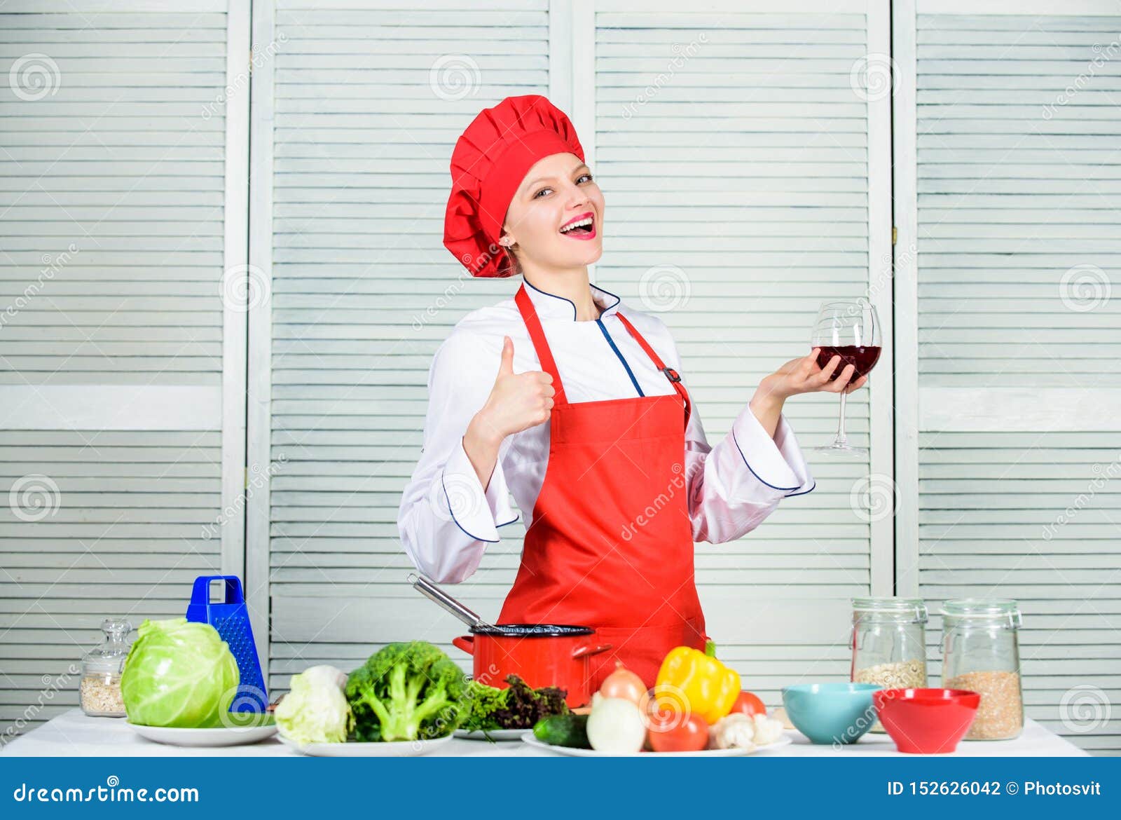 Professional Chef in Kitchen. Happy Woman Cooking Healthy Food by ...