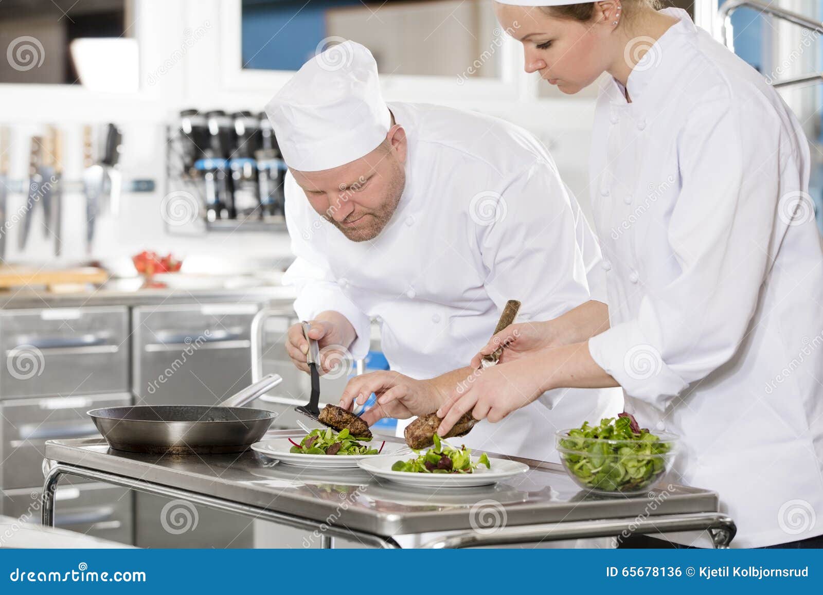 Professional Chefs Prepare Steak Dish at Restaurant Stock Photo Image